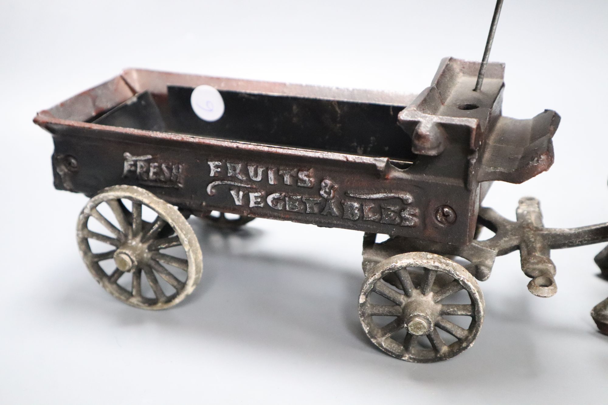 A cast iron model of a horse and carriage, length 37.5cm